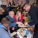 David Meade, founder of team-building company Lightbulb Teams, helping the Insights Ireland audience during their Give a Hand team-build | David Meade