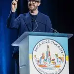 Corporate MC and Host, David Meade on stage at NECA 2025, Chicago, USA | David Meade Events