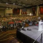 Corporate MC and Host, David Meade on stage at NECA 2025, Chicago, USA | David Meade Events