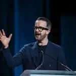 Corporate MC and Host, David Meade on stage at NECA 2025, Chicago, USA | David Meade Events