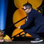 Corporate MC and Host, David Meade on stage at NECA 2025, Chicago, USA | David Meade Events