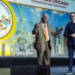 Corporate MC and Host, David Meade on stage at NECA 2025, Chicago, USA | David Meade Events