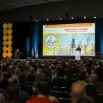 Corporate MC and Host, David Meade on stage at NECA 2025, Chicago, USA.| David Meade Events