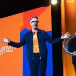 Corporate Event MC & Host, David Meade on stage at Relativity Fest 2025, Chicago, USA.