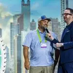 Corporate MC and Host, David Meade on stage at NECA 2025, Chicago, USA | David Meade Events