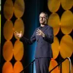 Corporate MC and Host, David Meade on stage at NECA 2025, Chicago, USA | David Meade Events